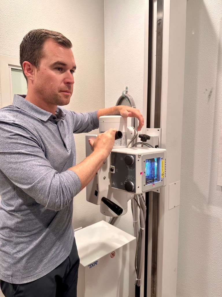 Dr. Brock Martin operating the in-office X-ray equipment